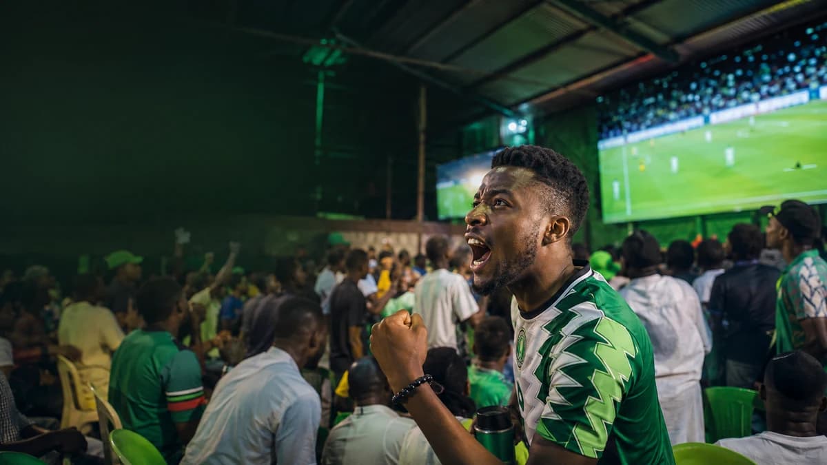AI editorial scene of Nigerian supporters watching football in a Lagos viewing centre