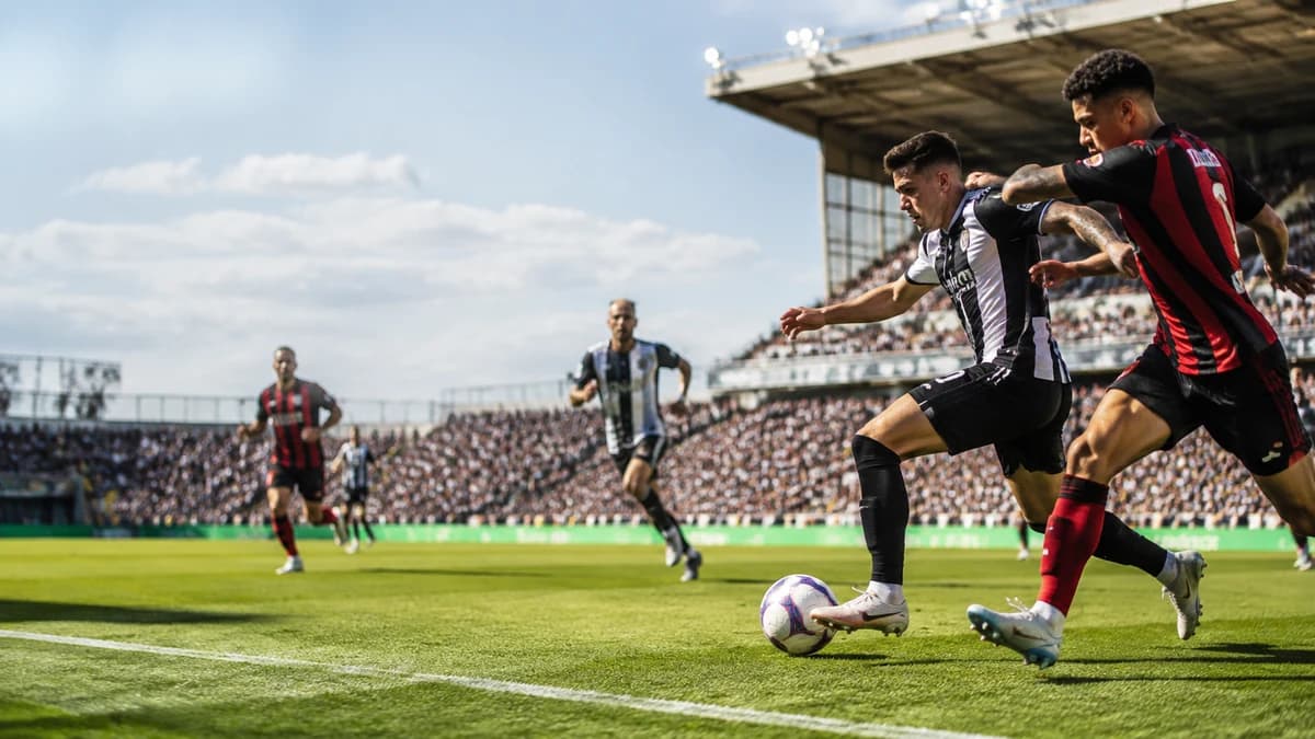 AI editorial scene of anonymous black-and-white and red-and-black teams contesting the ball