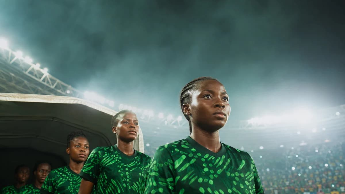 AI editorial scene of anonymous young Nigerian women footballers leaving a stadium tunnel