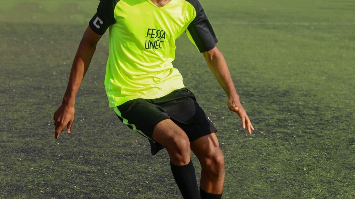 A footballer training on an artificial pitch; a generic licensed editorial illustration, not a Matchday 6 player.