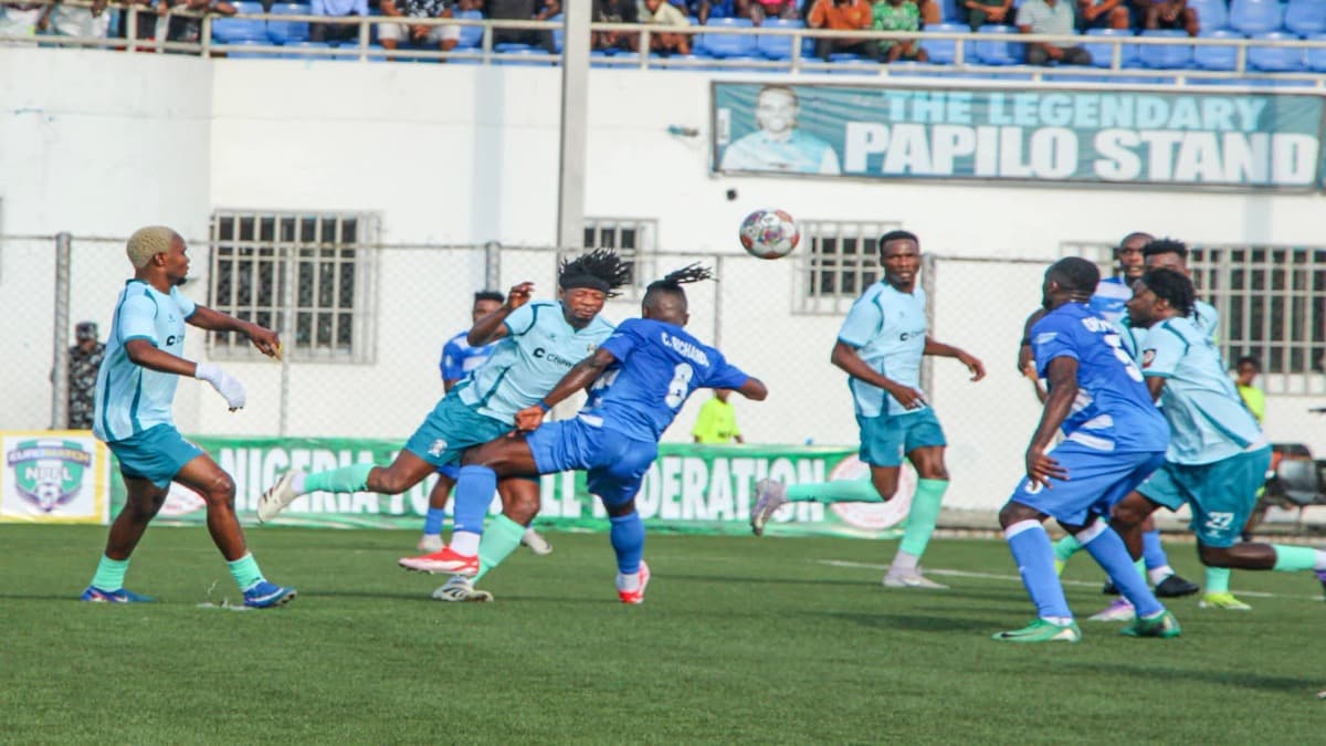 Enyimba and Shooting Stars players contest an aerial ball at Enyimba Stadium in Aba.