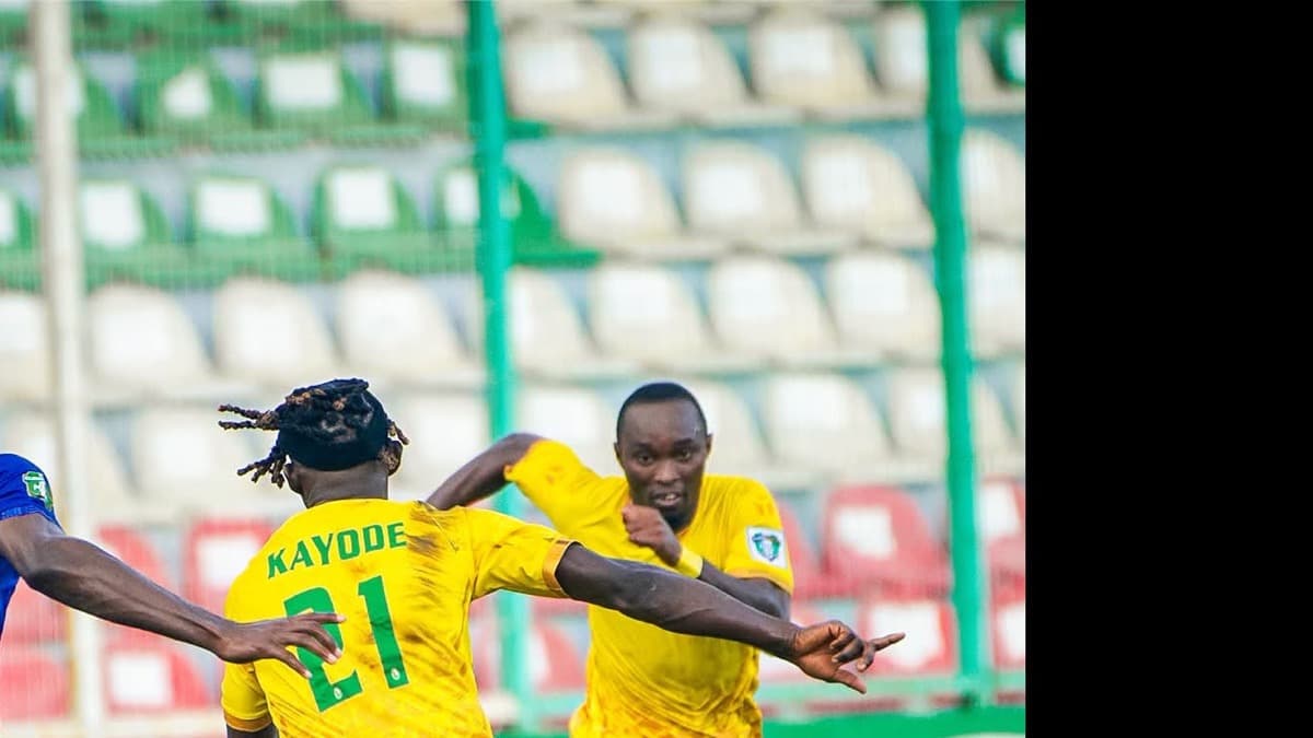 Bendel Insurance players in yellow contest the ball during their official NPFL match against Barau.