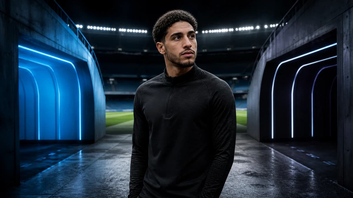 AI editorial composite of Omar Marmoush between sky-blue and navy-lit stadium tunnels
