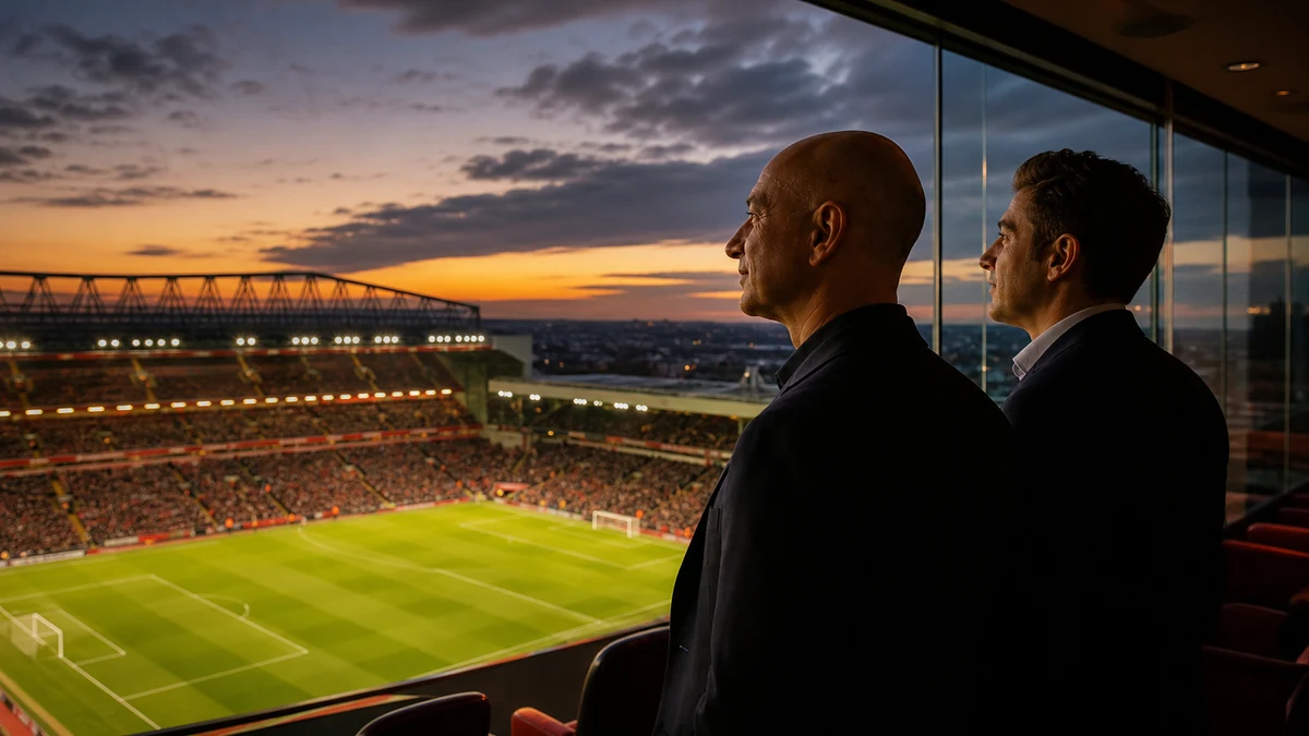 Two investors overlooking a floodlit Liverpool stadium from an executive suite